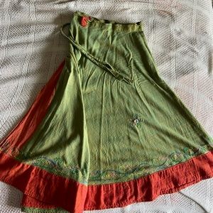 Olive green wrap skirt. Cute multicolor detailing at the bottoms.